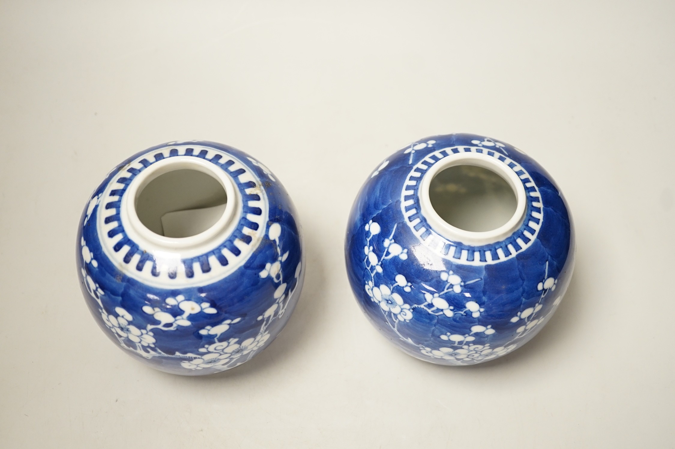 A pair of Chinese Blue and white prunus ginger jars. 15cm tall